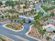 Aerial view of a lush neighborhood entry with palm trees lining the roadway at 4878 Califa Dr, Las Vegas, NV 89122