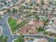 Community park with green spaces, mature trees, and winding walking paths at 4878 Califa Dr, Las Vegas, NV 89122