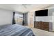 This bedroom features neutral walls, plush carpet, and a modern dresser with space for a large TV at 4878 Califa Dr, Las Vegas, NV 89122