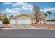 Charming single-story home featuring a three-car garage, low maintenance landscape, and a tile roof at 4878 Califa Dr, Las Vegas, NV 89122