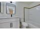 Bright bathroom featuring a modern vanity, framed mirror, and tiled shower-tub combination at 5330 E Charleston Blvd # 2, Las Vegas, NV 89142