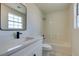Bathroom featuring a shower/tub combo, quartz countertops, and a modern vanity at 5330 E Charleston Blvd # 2, Las Vegas, NV 89142