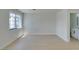 Bright bedroom with a large window and modern, neutral paint, showing off the neutral laminate floors at 5330 E Charleston Blvd # 2, Las Vegas, NV 89142