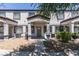 Charming townhome featuring a quaint front porch and well-maintained gravel landscaping for added curb appeal at 5330 E Charleston Blvd # 2, Las Vegas, NV 89142