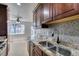 Modern kitchen features stainless steel appliances, granite countertops, and mosaic tile backsplash at 5330 E Charleston Blvd # 2, Las Vegas, NV 89142