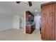 Open floor plan with a kitchen featuring cherry cabinets, tile backsplash, and stainless steel appliances at 5330 E Charleston Blvd # 2, Las Vegas, NV 89142