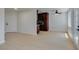 Open concept living room and kitchen area with wood-look floors, lots of natural light, and modern ceiling fans at 5330 E Charleston Blvd # 2, Las Vegas, NV 89142
