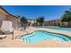 Community pool features a jacuzzi, sun loungers and landscaped communal areas at 5330 E Charleston Blvd # 2, Las Vegas, NV 89142