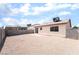 Spacious backyard featuring a gravel area with patio, block wall, and access to the home at 5751 Mabel Rd, Las Vegas, NV 89110