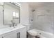 Bathroom featuring a marble-tiled shower with niche and a vanity with mirror and modern fixtures at 5751 Mabel Rd, Las Vegas, NV 89110