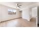 Bright bedroom with light wood floors, closet with sliding doors, and a window for natural light at 5751 Mabel Rd, Las Vegas, NV 89110