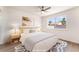 Serene bedroom with natural light, featuring a comfortable bed and stylish bedside tables at 5751 Mabel Rd, Las Vegas, NV 89110