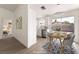 Bright dining area featuring a modern chandelier and sliding glass doors to the outdoor area at 5751 Mabel Rd, Las Vegas, NV 89110