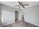 Cozy bedroom featuring hardwood floors, a closet, a ceiling fan, and a window at 5823 Rose Sage St, North Las Vegas, NV 89031