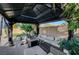 Gazebo featuring comfortable seating around a fire pit, perfect for outdoor entertaining and relaxation at 5823 Rose Sage St, North Las Vegas, NV 89031