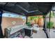 This comfortable gazebo offers ample seating and a fire pit, making it a relaxing addition to the backyard at 5823 Rose Sage St, North Las Vegas, NV 89031