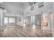 Bright and airy living room with high ceilings, wood-look floors, and lots of natural light at 5823 Rose Sage St, North Las Vegas, NV 89031