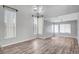 Spacious, open living room with soaring ceilings, wood-look flooring, and lots of natural light at 5823 Rose Sage St, North Las Vegas, NV 89031