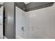 Modern shower and tub combo featuring tiled walls, chrome fixtures, and a shower head at 5823 Rose Sage St, North Las Vegas, NV 89031