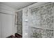 Organized walk-in closet with built-in shelving and decorative wallpaper at 5823 Rose Sage St, North Las Vegas, NV 89031