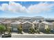 A neighborhood of charming homes with an expansive view of distant mountains under a vast sky at 6322 Angora Peak Ln, Las Vegas, NV 89115