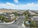 Aerial view of a gated community featuring a pool and well-maintained landscaping at 6322 Angora Peak Ln, Las Vegas, NV 89115