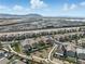 Aerial view of residential area with modern homes near industrial zone and mountains at 6322 Angora Peak Ln, Las Vegas, NV 89115