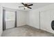 This simple bedroom offers natural lighting, neutral colored walls and carpet, and closet space at 6322 Angora Peak Ln, Las Vegas, NV 89115
