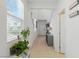 Bright entryway featuring a staircase, neutral decor, and tile flooring at 6322 Angora Peak Ln, Las Vegas, NV 89115
