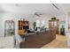 Comfortable living room features tile flooring, ceiling fan, and plentiful natural light at 6322 Angora Peak Ln, Las Vegas, NV 89115