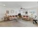 Living room features comfortable couches, warm decor, and abundant natural light at 6322 Angora Peak Ln, Las Vegas, NV 89115