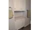 Bathroom featuring a storage area with white cabinets and drawers at 6650 W Warm Springs Rd # 2159, Las Vegas, NV 89118