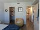 Open bedroom view with a walk-in closet, light walls, and a chair for relaxing at 6650 W Warm Springs Rd # 2159, Las Vegas, NV 89118
