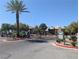 Gated community entrance with mature landscaping offers a secure environment at 6650 W Warm Springs Rd # 2159, Las Vegas, NV 89118