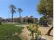Green common area with playground and desert landscaping in a residential community at 6650 W Warm Springs Rd # 2159, Las Vegas, NV 89118