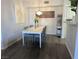 Bright dining area features a modern chandelier and seating for four at 6650 W Warm Springs Rd # 2159, Las Vegas, NV 89118