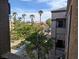 Building exterior showing nice landscaping with palm trees and surrounding greenery at 6650 W Warm Springs Rd # 2159, Las Vegas, NV 89118