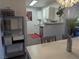 Charming kitchen view, with modern white cabinets and stainless steel appliances at 6650 W Warm Springs Rd # 2159, Las Vegas, NV 89118