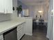 Modern kitchen with white cabinets, stainless steel appliances, and an open view to the dining area at 6650 W Warm Springs Rd # 2159, Las Vegas, NV 89118