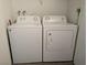 Washer and dryer laundry set with a top load washing machine and a front load dryer at 6650 W Warm Springs Rd # 2159, Las Vegas, NV 89118