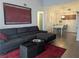 Bright living room featuring a comfortable sectional couch, dining area, and stylish decor at 6650 W Warm Springs Rd # 2159, Las Vegas, NV 89118