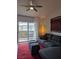 Inviting living area with a large sectional couch and natural light from the balcony at 6650 W Warm Springs Rd # 2159, Las Vegas, NV 89118