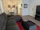 Inviting living room with gray sofa, and a view of the dining area at 6650 W Warm Springs Rd # 2159, Las Vegas, NV 89118