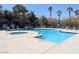 Inviting community pool and spa surrounded by lush landscaping and lounge chairs at 6650 W Warm Springs Rd # 2159, Las Vegas, NV 89118