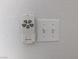 Image shows white ceiling fan remote, light switch, and outlet at 6650 W Warm Springs Rd # 2159, Las Vegas, NV 89118