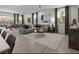 Bright and airy living room with modern furniture, stylish decor, and ample natural light at 737 Wild Highlands Ln, Henderson, NV 89015