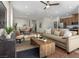 Inviting living room featuring a plush sofa, stylish decor, seamlessly connected to the dining and kitchen areas at 739 Wild Highlands Ln, Henderson, NV 89015