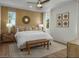 Serene main bedroom with neutral tones, ambient lighting, plush bedding, and tasteful decor for relaxation at 739 Wild Highlands Ln, Henderson, NV 89015