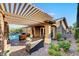 Inviting outdoor living space with a covered patio, comfortable seating, and a view of the refreshing pool at 748 Puerto Real Ct, Las Vegas, NV 89138