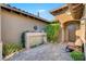 This courtyard has decorative shrubbery, an outdoor bench and a stone water feature at 748 Puerto Real Ct, Las Vegas, NV 89138